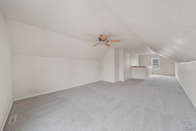 1107 Sunset Dr, Tecumseh, MI 49286 - bonus room with lofted ceiling, carpet flooring, ceiling fan, and baseboards