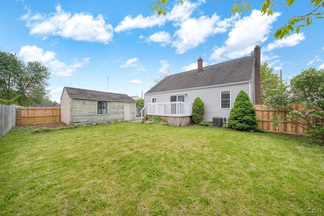 1107 Sunset Dr, Tecumseh, MI 49286 - back of property with an outbuilding, central AC, a chimney, and a wooden deck