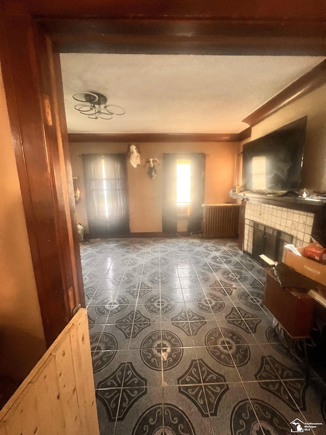 living area featuring tile patterned floors and a fireplace