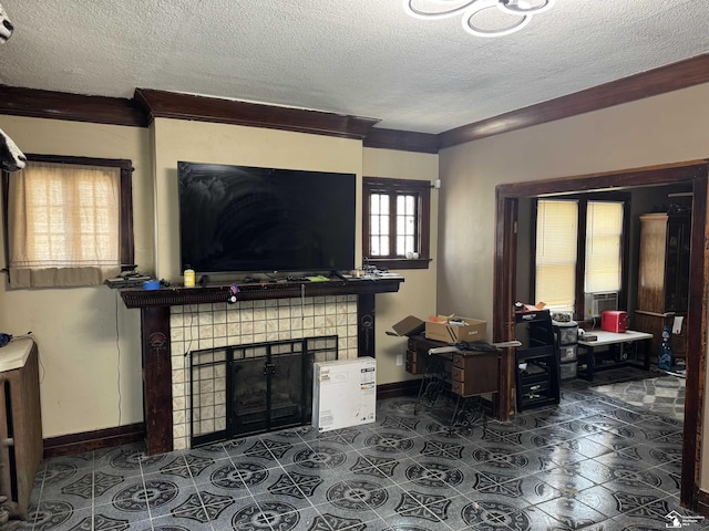 living room with a textured ceiling, a tiled fireplace, healthy amount of natural light, an office area, and ornamental molding