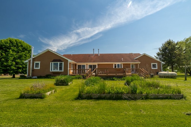 34699 Fuerstenau Rd, Richmond, MI 48062 - rear view of property with a wooden deck, a lawn, and a vegetable garden