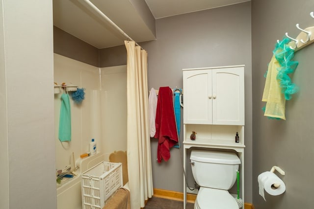 34699 Fuerstenau Rd, Richmond, MI 48062 - bathroom with toilet, shower / bath combination with curtain, and baseboards