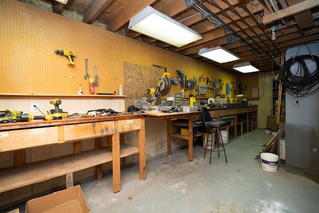 34699 Fuerstenau Rd, Richmond, MI 48062 - miscellaneous room featuring a workshop area and unfinished concrete flooring