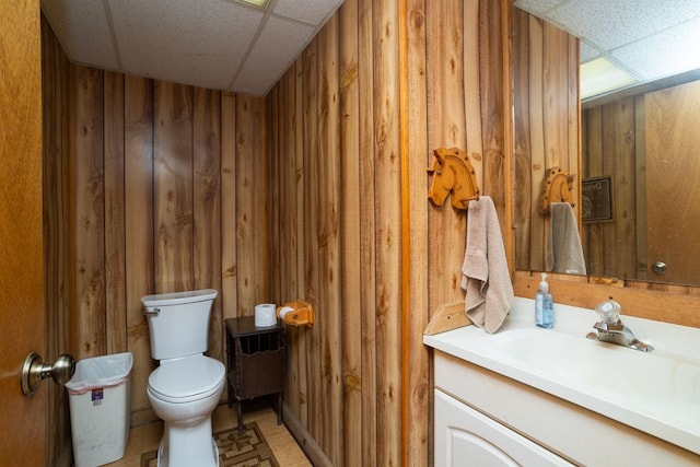 34699 Fuerstenau Rd, Richmond, MI 48062 - half bath with a paneled ceiling, wooden walls, toilet, and vanity