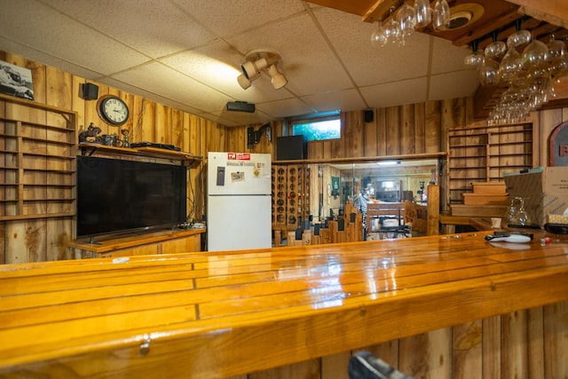 34699 Fuerstenau Rd, Richmond, MI 48062 - living area with wood walls and a drop ceiling