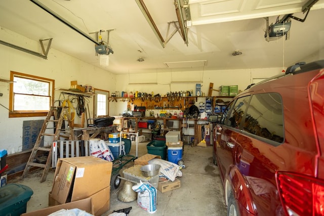 34699 Fuerstenau Rd, Richmond, MI 48062 - garage featuring a garage door opener and a workshop area