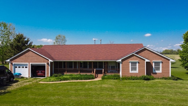 34699 Fuerstenau Rd, Richmond, MI 48062 - ranch-style house featuring an attached garage, a front lawn, covered porch, and driveway