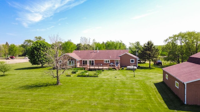 34699 Fuerstenau Rd, Richmond, MI 48062 - rear view of house featuring a wooden deck and a yard