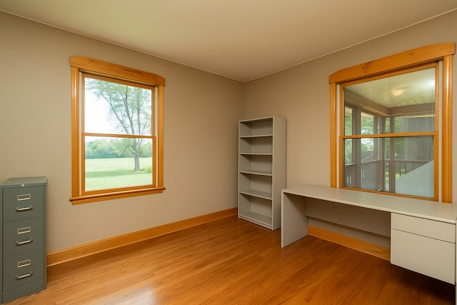 34699 Fuerstenau Rd, Richmond, MI 48062 - unfurnished office with wood finished floors, plenty of natural light, and baseboards