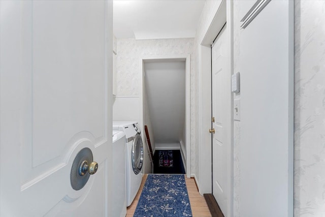 28605 Southpointe Rd, Grosse Ile, MI 48138 - clothes washing area featuring washer and dryer and light wood-style flooring