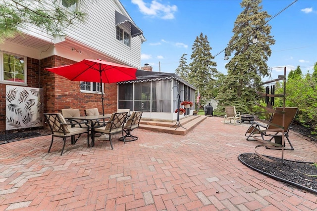 28605 Southpointe Rd, Grosse Ile, MI 48138 - view of patio with a sunroom and outdoor dining area