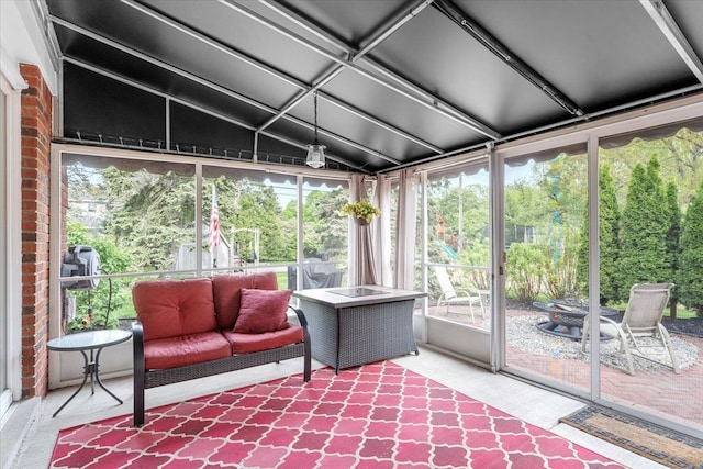 28605 Southpointe Rd, Grosse Ile, MI 48138 - sunroom / solarium featuring lofted ceiling and an outdoor living space with a fire pit