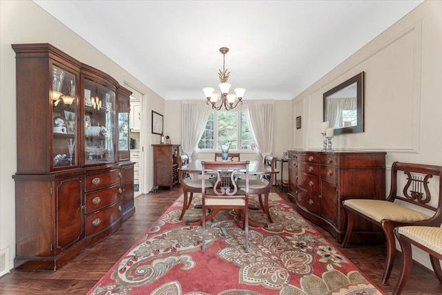 28605 Southpointe Rd, Grosse Ile, MI 48138 - dining room featuring a chandelier and dark wood-style flooring