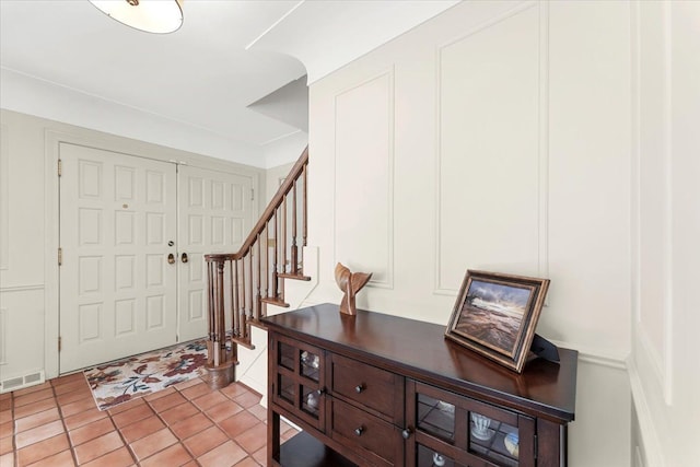 28605 Southpointe Rd, Grosse Ile, MI 48138 - foyer featuring a decorative wall and stairs