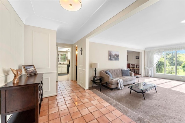 28605 Southpointe Rd, Grosse Ile, MI 48138 - living room with light tile patterned floors and a decorative wall