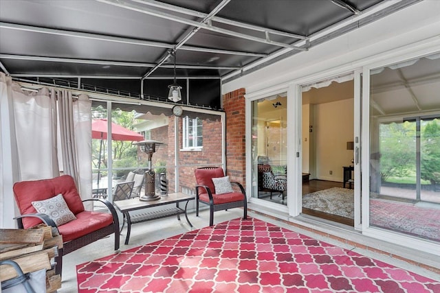 28605 Southpointe Rd, Grosse Ile, MI 48138 - sunroom / solarium featuring wood finished floors and brick wall