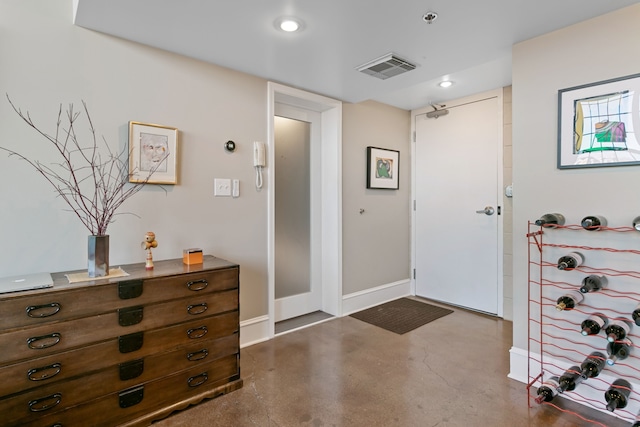 3434 Russell St Unit 28-205, Detroit, MI 48207 - entryway with finished concrete floors, baseboards, and recessed lighting