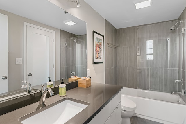 3434 Russell St Unit 28-205, Detroit, MI 48207 - full bath featuring toilet, bathing tub / shower combination, vanity, and tile patterned floors