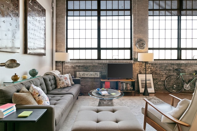3434 Russell St Unit 28-205, Detroit, MI 48207 - living room with brick wall