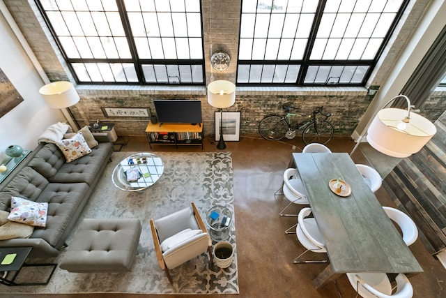 3434 Russell St Unit 28-205, Detroit, MI 48207 - living room with concrete floors