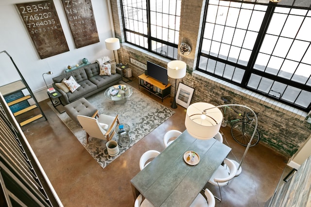 3434 Russell St Unit 28-205, Detroit, MI 48207 - living room with finished concrete flooring