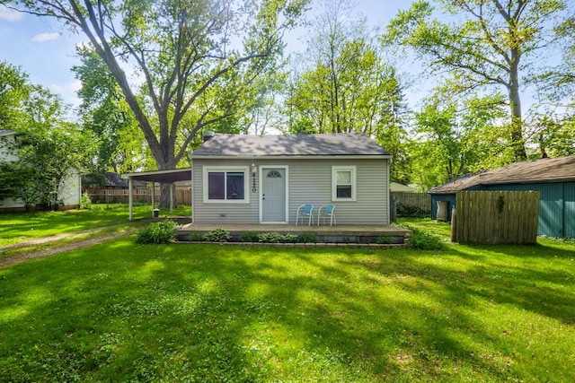 4120 Bunker Ave, West Bloomfield, MI 48323 - back of house with an outbuilding and a carport