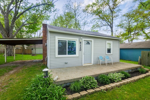 4120 Bunker Ave, West Bloomfield, MI 48323 - rear view of house with a chimney and a patio area