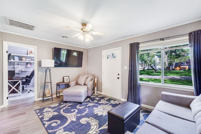 4120 Bunker Ave, West Bloomfield, MI 48323 - living room featuring an office area, wood finished floors, a ceiling fan, crown molding, and baseboards