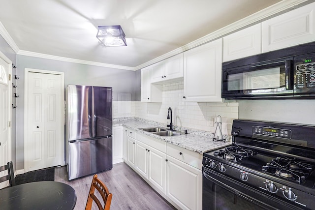 4120 Bunker Ave, West Bloomfield, MI 48323 - kitchen featuring black appliances, a sink, white cabinetry, wood finished floors, and ornamental molding