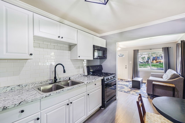 4120 Bunker Ave, West Bloomfield, MI 48323 - kitchen with black appliances, a sink, dark wood-style flooring, backsplash, and ornamental molding