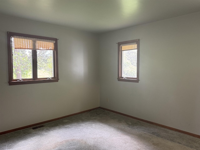 1627 S M-52 Hwy, Owosso, MI 48867 - spare room featuring carpet and baseboards