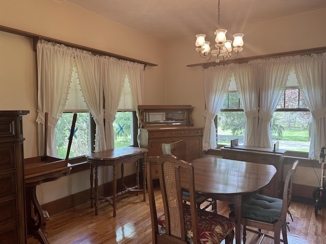 1627 S M-52 Hwy, Owosso, MI 48867 - dining room featuring a chandelier and wood finished floors