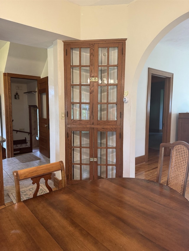 1627 S M-52 Hwy, Owosso, MI 48867 - dining space with arched walkways, french doors, and wood finished floors