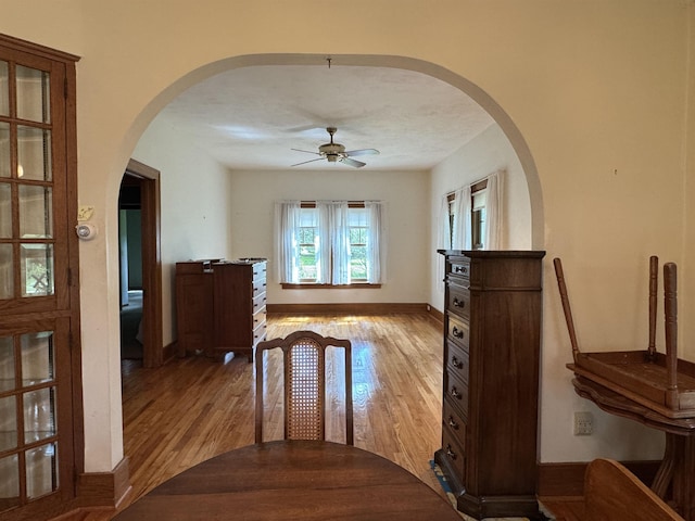 1627 S M-52 Hwy, Owosso, MI 48867 - hallway with arched walkways, light wood-style flooring, and baseboards