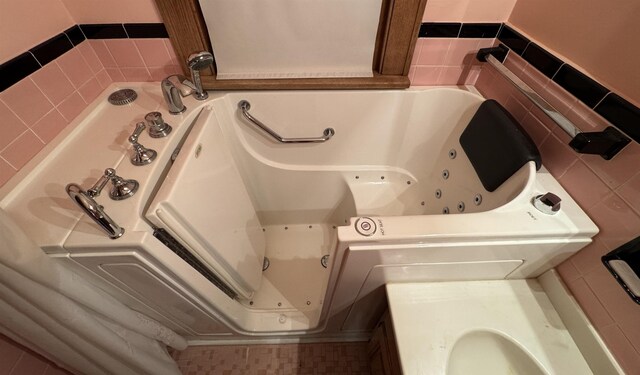1627 S M-52 Hwy, Owosso, MI 48867 - full bath featuring a jetted tub and tile walls