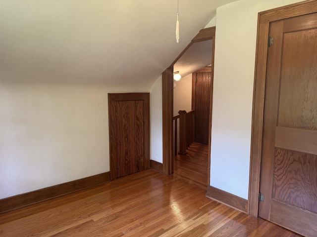 1627 S M-52 Hwy, Owosso, MI 48867 - additional living space with wood finished floors, lofted ceiling, and baseboards
