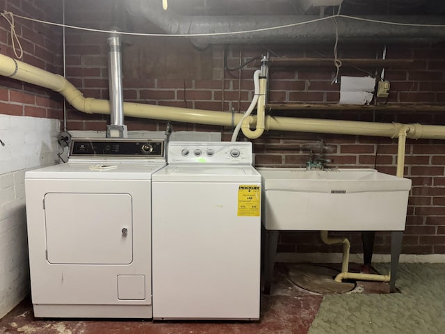 1627 S M-52 Hwy, Owosso, MI 48867 - laundry room featuring independent washer and dryer and concrete block wall