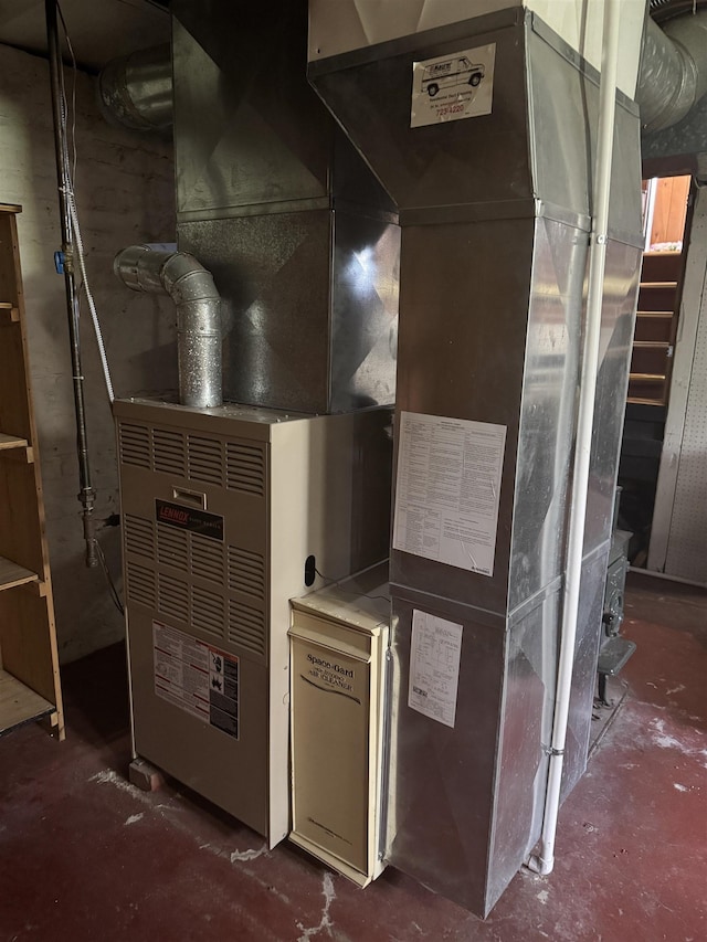 1627 S M-52 Hwy, Owosso, MI 48867 - utility room featuring heating unit