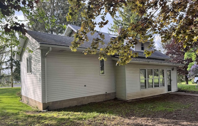 1627 S M-52 Hwy, Owosso, MI 48867 - view of side of property with a shingled roof and a lawn