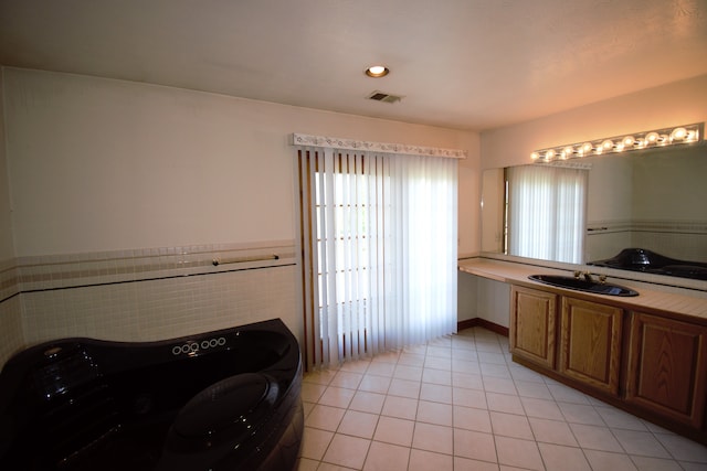 23049 27 Mile Rd, Ray, MI 48096 - bathroom with tile patterned floors, vanity, and wainscoting