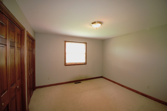 23049 27 Mile Rd, Ray, MI 48096 - unfurnished bedroom featuring light colored carpet and baseboards