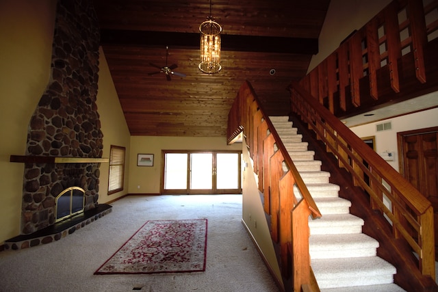 23049 27 Mile Rd, Ray, MI 48096 - stairs with high vaulted ceiling, carpet flooring, ceiling fan, a stone fireplace, and beam ceiling