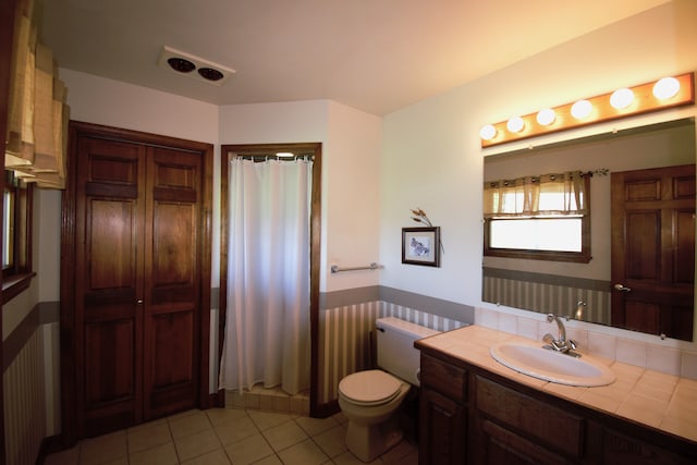 23049 27 Mile Rd, Ray, MI 48096 - bathroom featuring tile patterned floors, wainscoting, toilet, a shower with curtain, and vanity