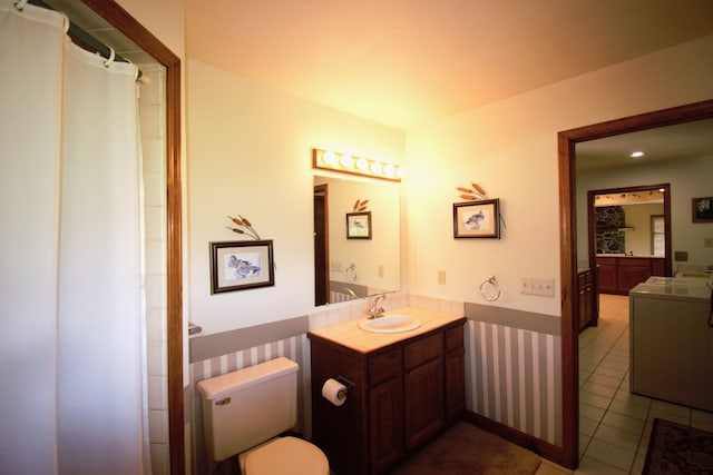 23049 27 Mile Rd, Ray, MI 48096 - full bathroom with tile patterned flooring, vanity, toilet, and washer / clothes dryer