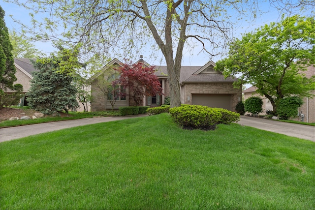 4958 Countryside Dr, West Bloomfield, MI 48323 - obstructed view of property with a front yard, concrete driveway, brick siding, a garage, and a chimney