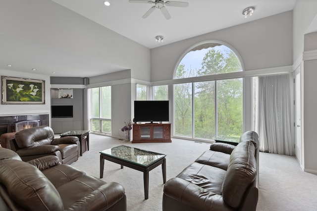 4958 Countryside Dr, West Bloomfield, MI 48323 - carpeted living area featuring healthy amount of natural light, ceiling fan, a high end fireplace, and high vaulted ceiling