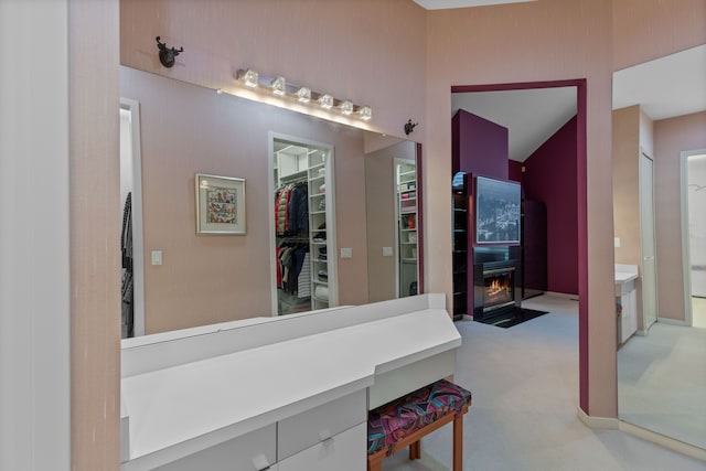 4958 Countryside Dr, West Bloomfield, MI 48323 - bathroom with a spacious closet and a fireplace with flush hearth