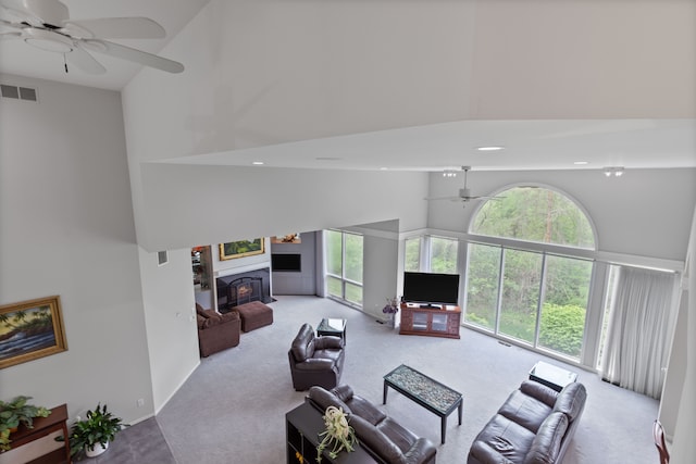 4958 Countryside Dr, West Bloomfield, MI 48323 - living area featuring high vaulted ceiling, ceiling fan, carpet floors, a glass covered fireplace, and recessed lighting