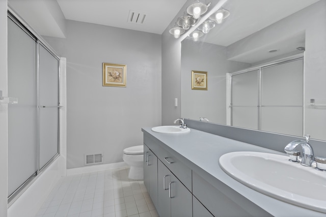 4958 Countryside Dr, West Bloomfield, MI 48323 - bathroom with tile patterned flooring, toilet, baseboards, double vanity, and bath / shower combo with glass door