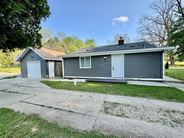 4915 Clarkston Rd, Clarkston, MI 48348 - ranch-style home with an outbuilding, driveway, a chimney, a detached garage, and a front yard
